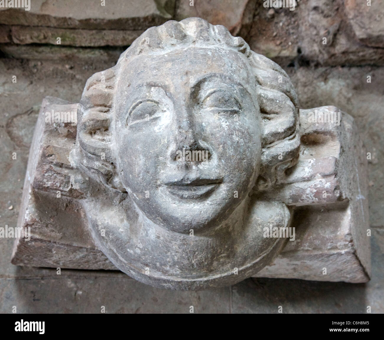 Decorated roof boss in the form of a woman's head from Dore Abbey in Herefordshire's Golden Valley Stock Photo