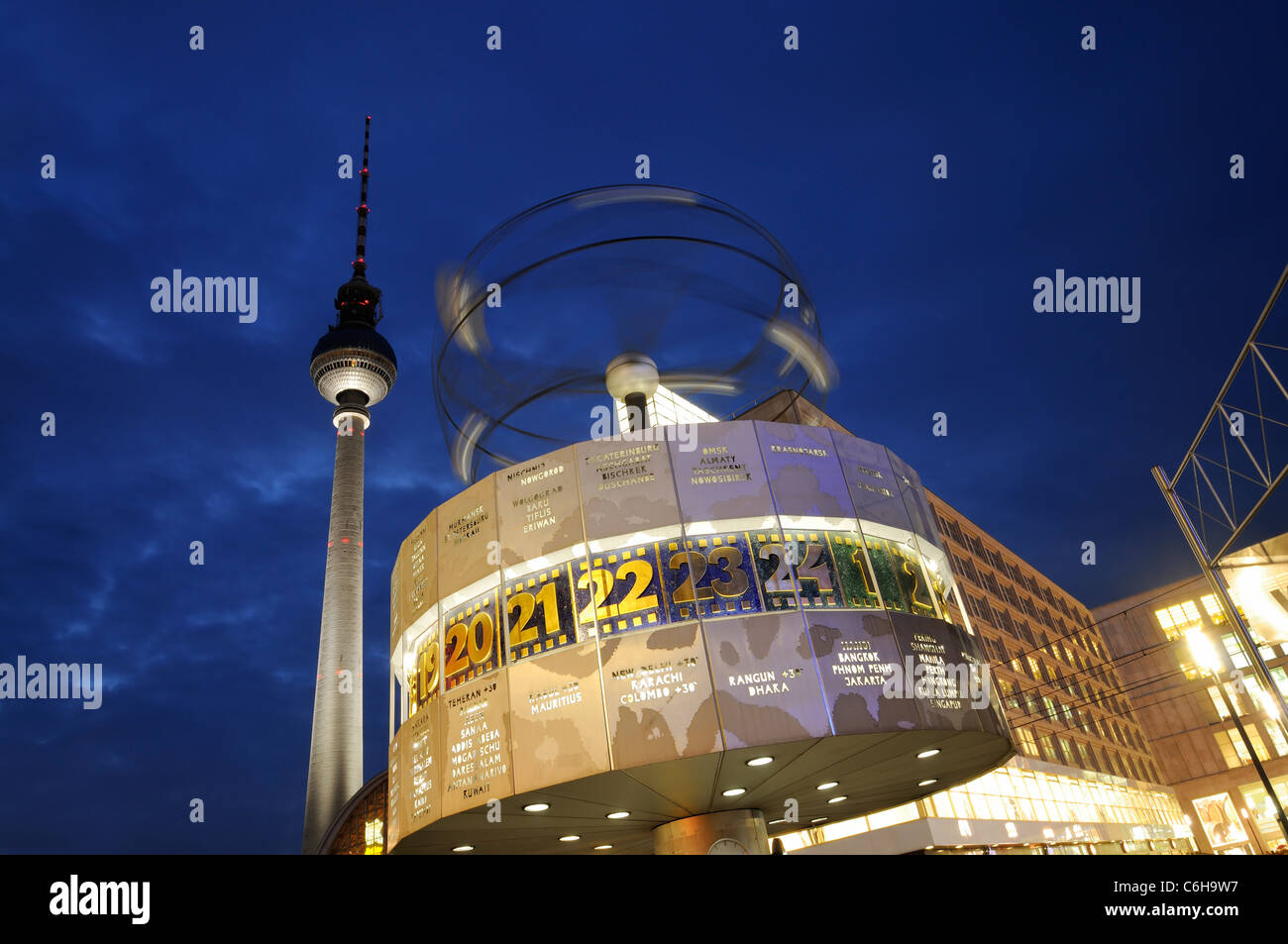 Famous World clock at Alexanderplatz with the TV tower by night, Berlin, Germany. Stock Photo