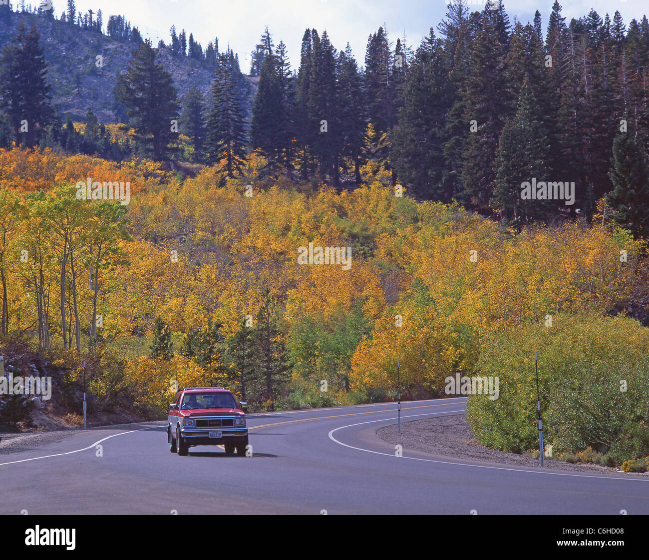 Car on road in autumn (fall), Lake Tahoe, Sierra Nevada, California, United States of America Stock Photo