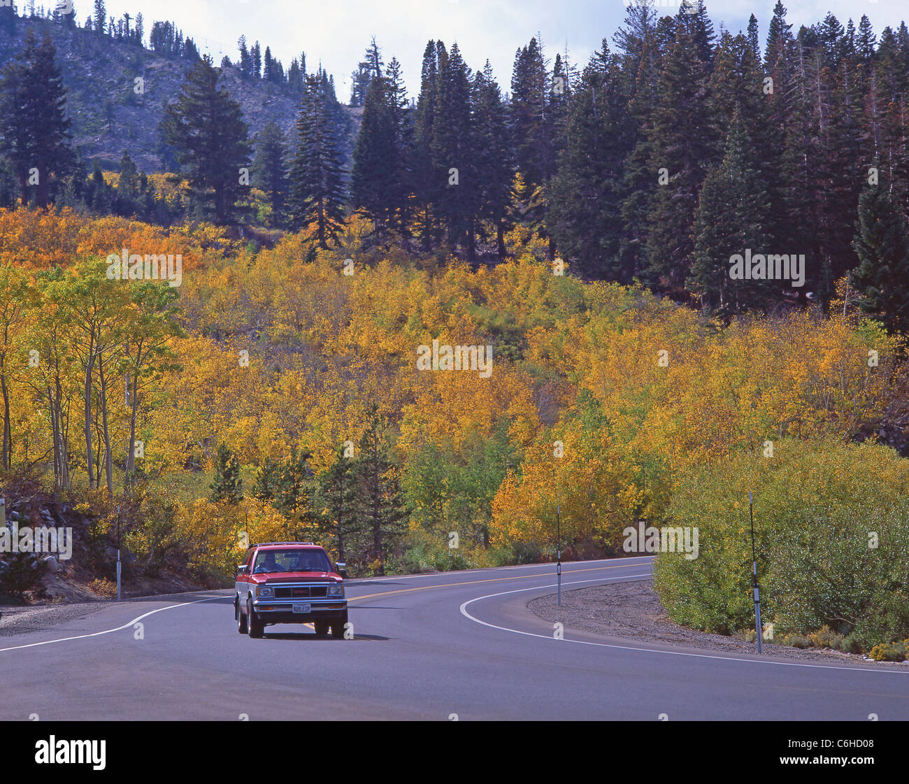 Car on road in autumn (fall), Lake Tahoe, Sierra Nevada, California, United States of America