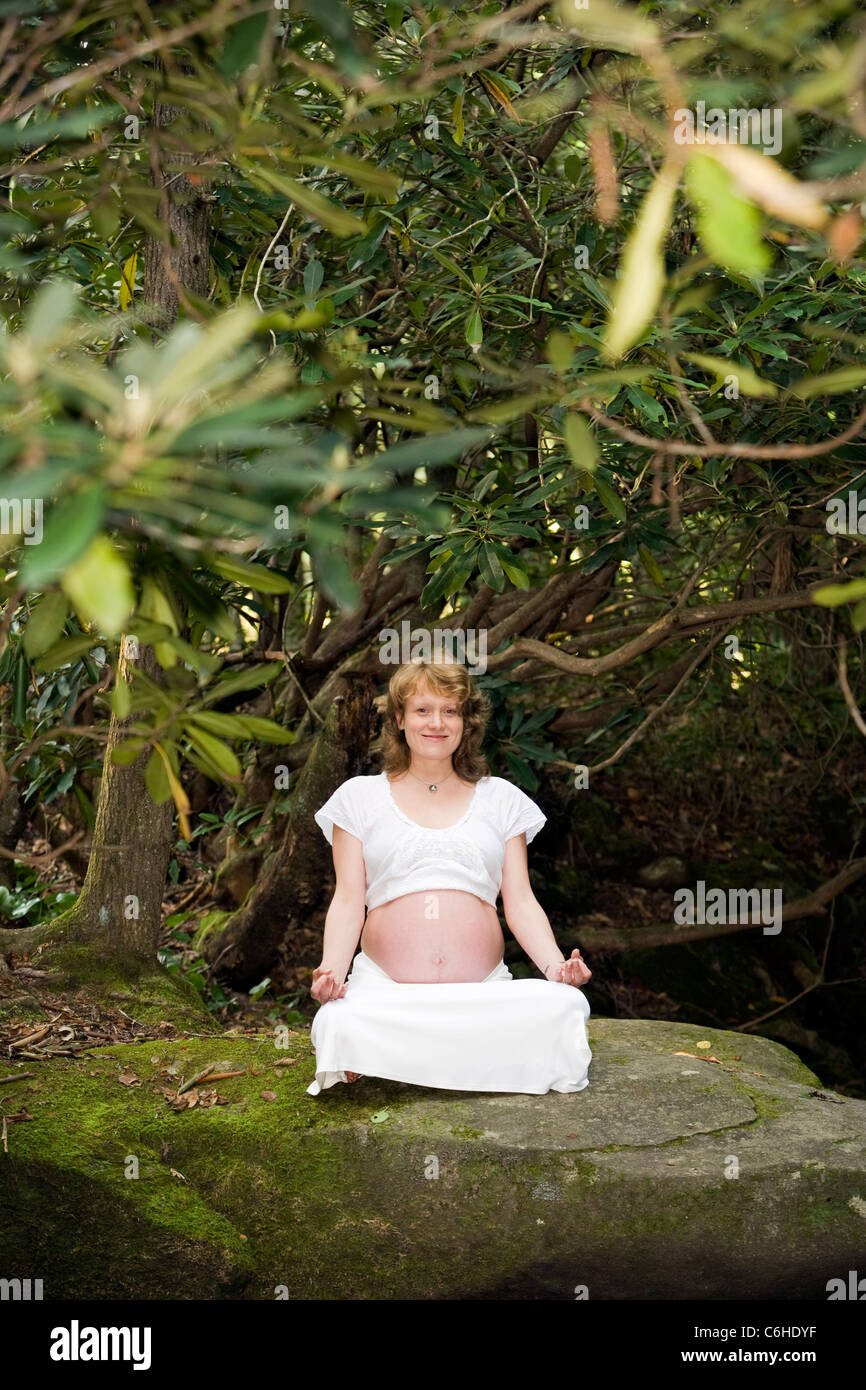 Pregnant Woman doing Yoga - Pisgah National Forest - near Brevard, North Carolina, USA Stock Photo