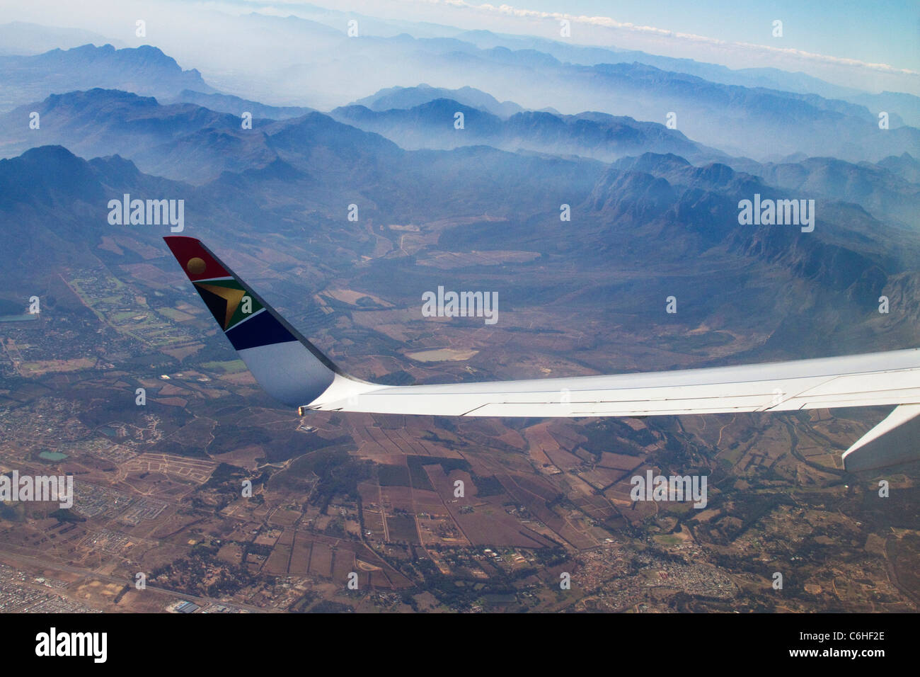 The wing tip of a SAA jet viewed against the Cape Fold mountains near Cape Town Stock Photo