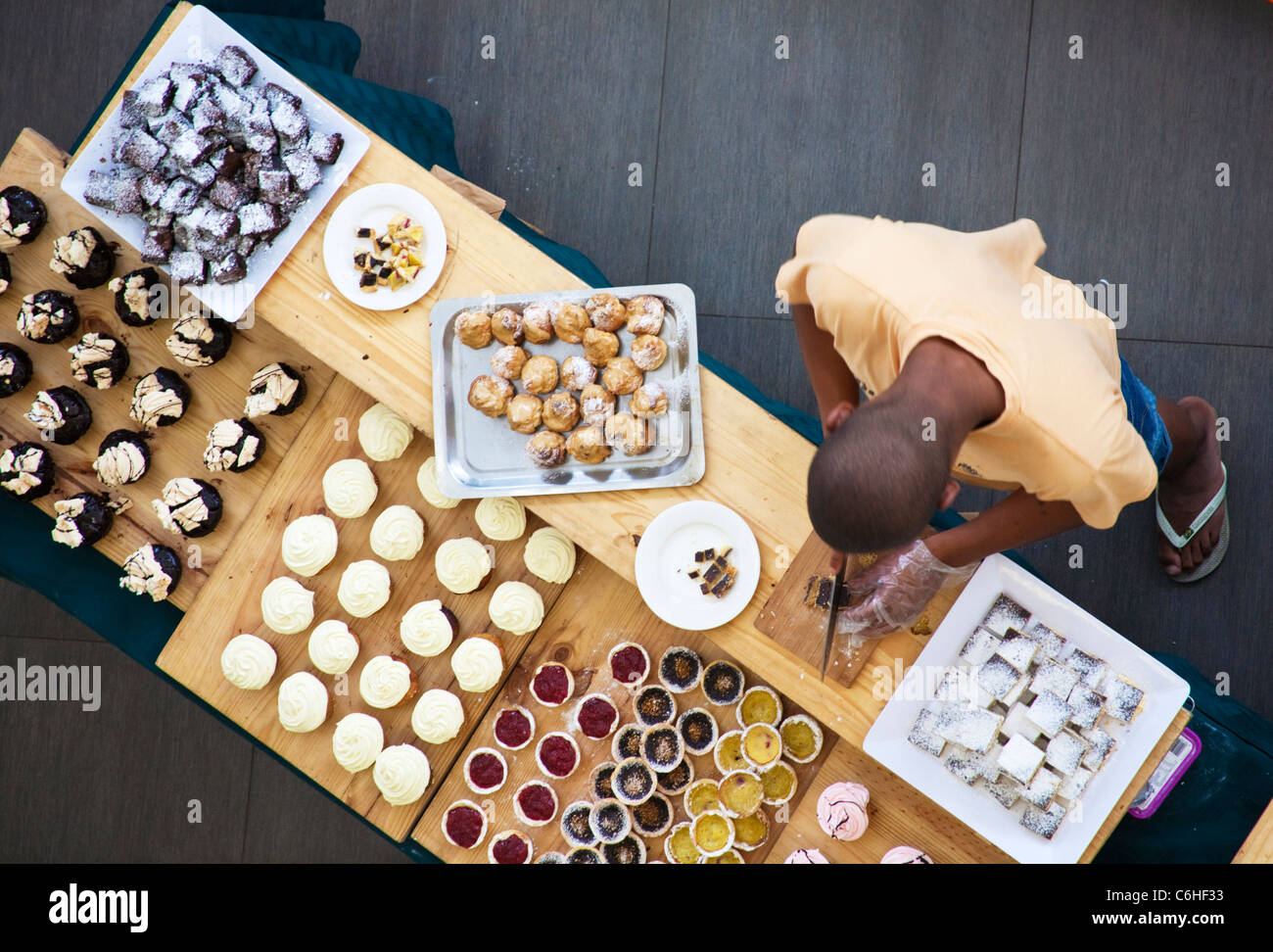 Overhead view of a man preparing confectionery in a Morningside, Sandton Shopping mall Stock Photo
