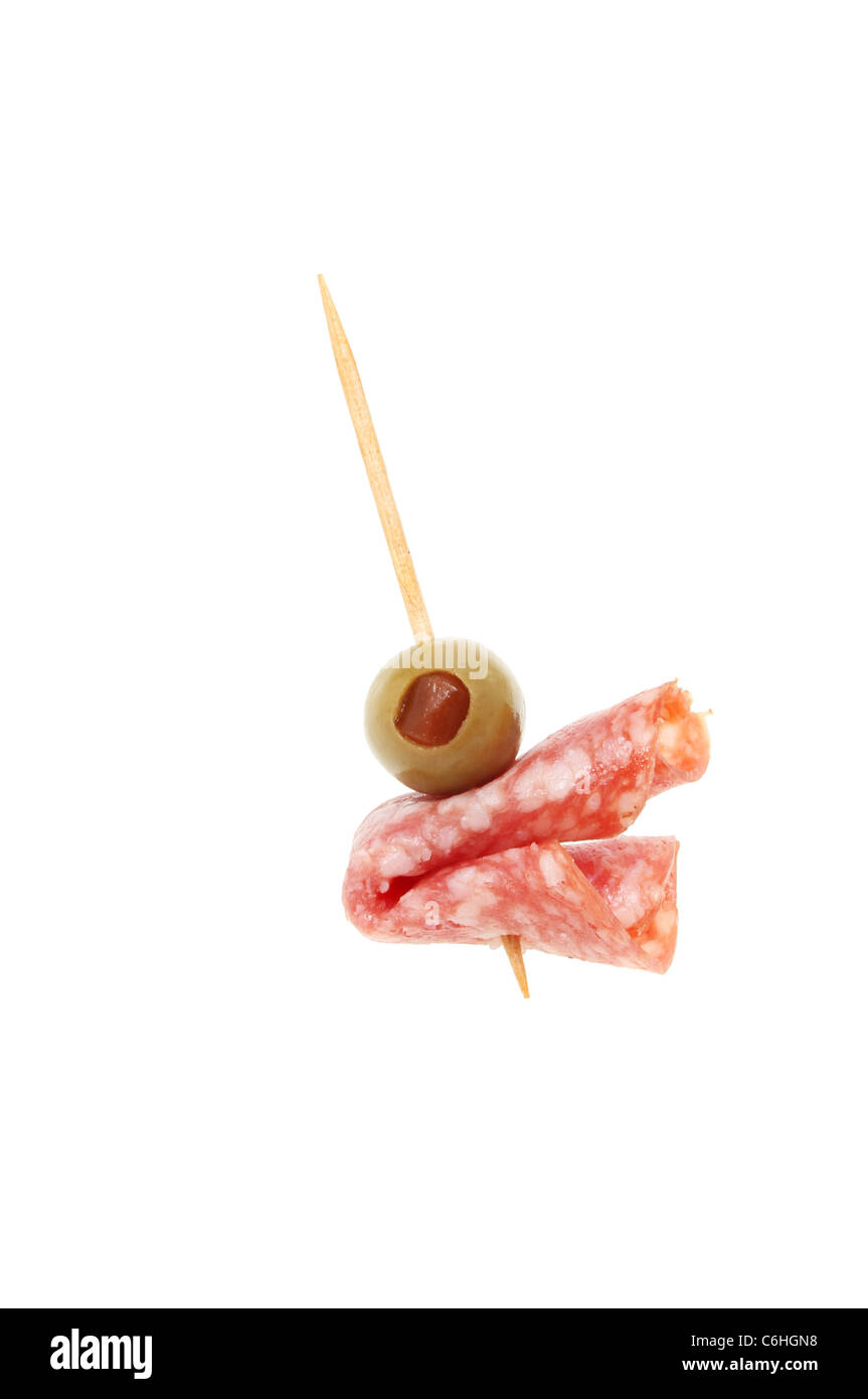 Olive and salami on a cocktail stick isolated against white Stock Photo