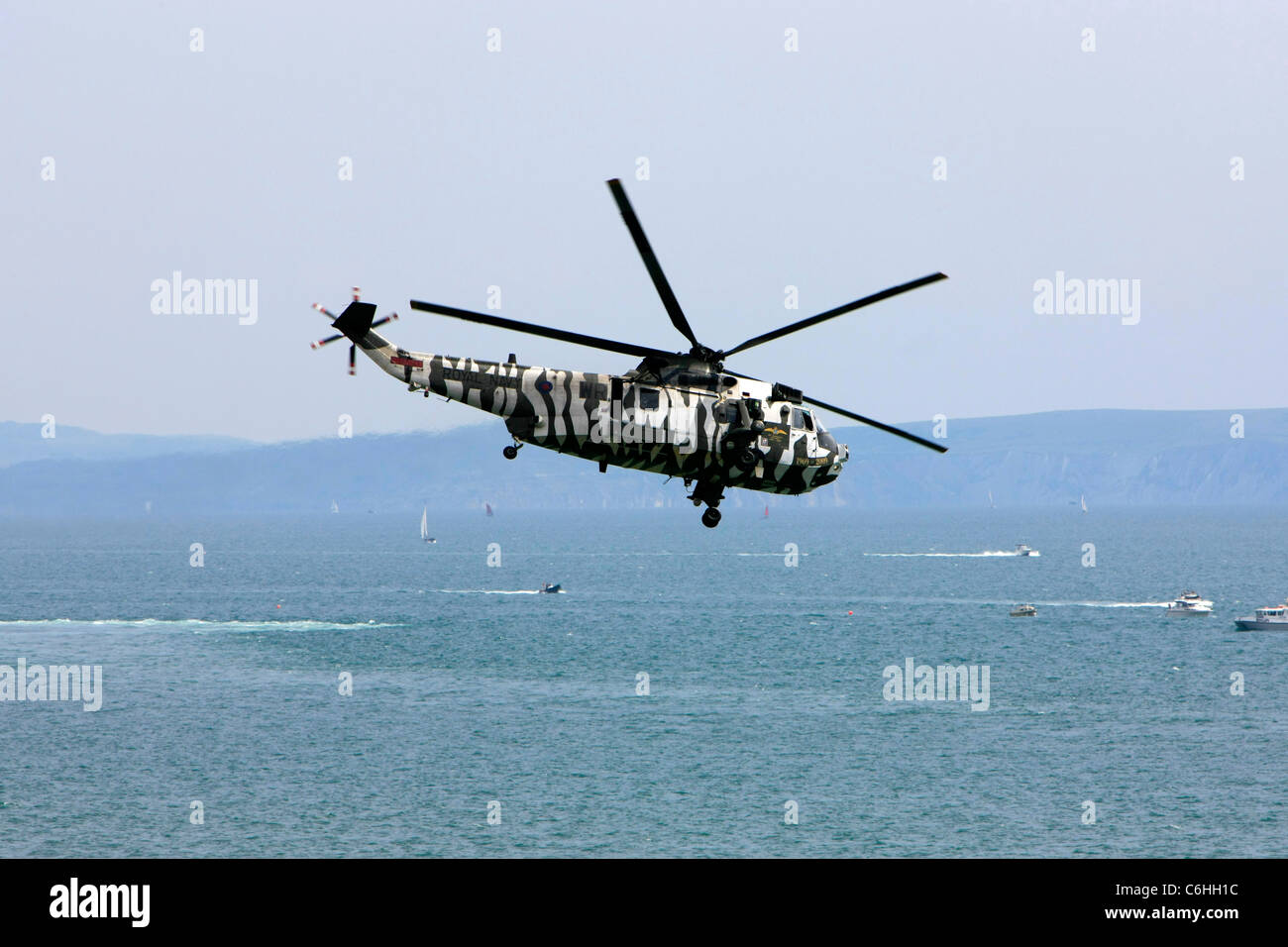 British Royal Navy Seaking Helicopter wearing IFOR Stripe camoflage Stock Photo