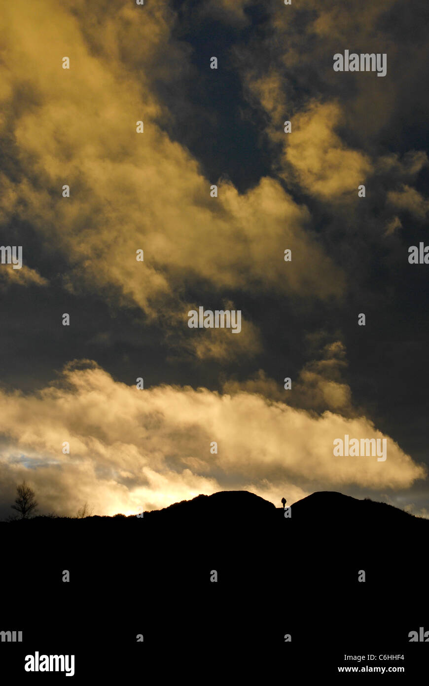 A lone figure walking through Heaven's Gate on the Wrekin hill Shropshire UK Stock Photo