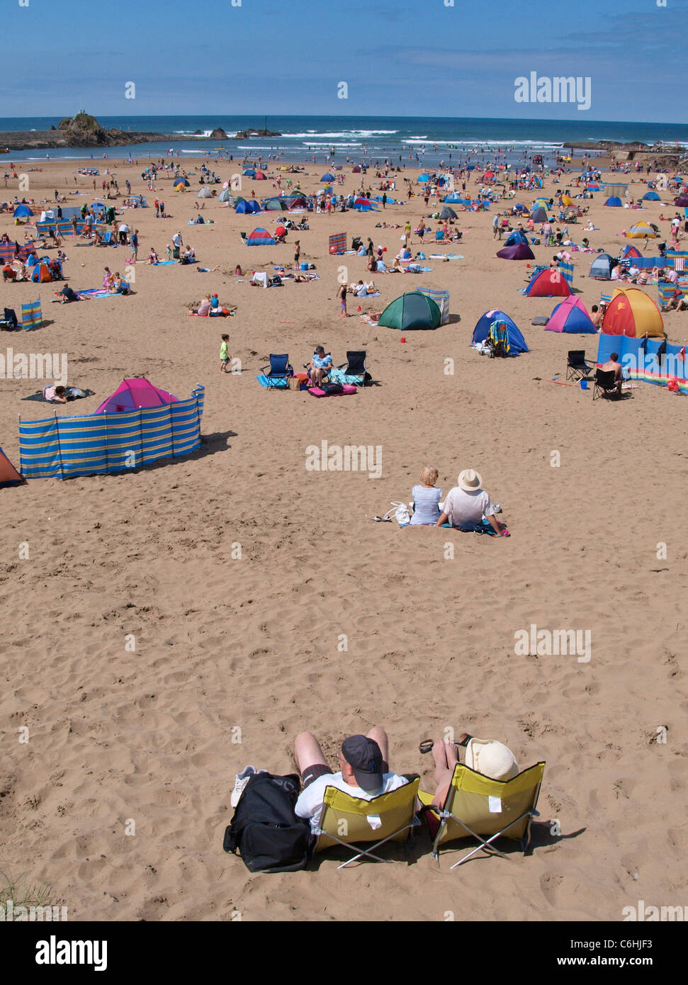 Busy day at Bude beach, Bude, Cornwall, UK Stock Photo