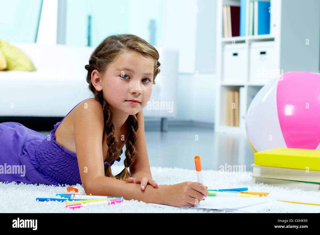 Portrait of lovely girl drawing with colorful pencils Stock Photo - Alamy