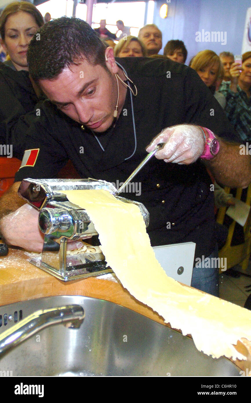 Celebrity Chef Gino D'Acampo cooking fettuccine carbonara at Connswater