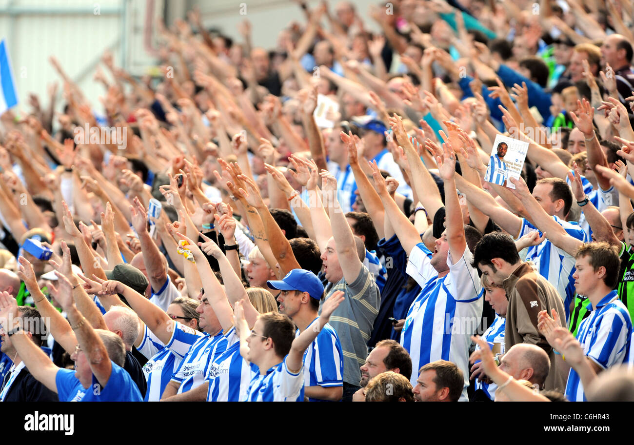 Brighton and Hove Albion football fans cheer on their team during a match at American Express Community Stadium aka The Amex Stock Photo