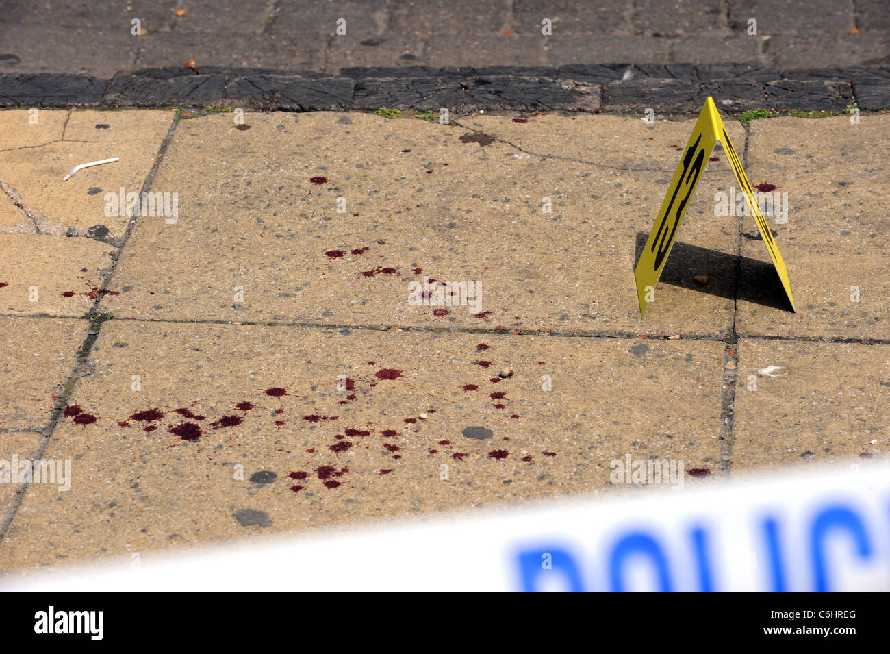 Blood splattered on the floor after a fight on Brighton beach Stock Photo