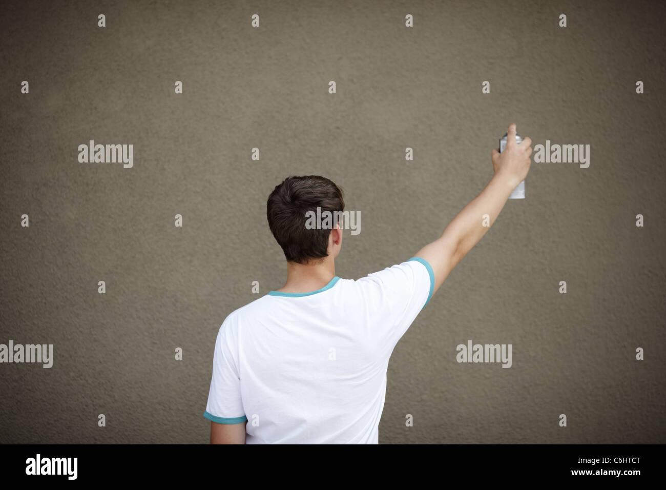 Young teen with paint spray and empty areas for your text Stock Photo