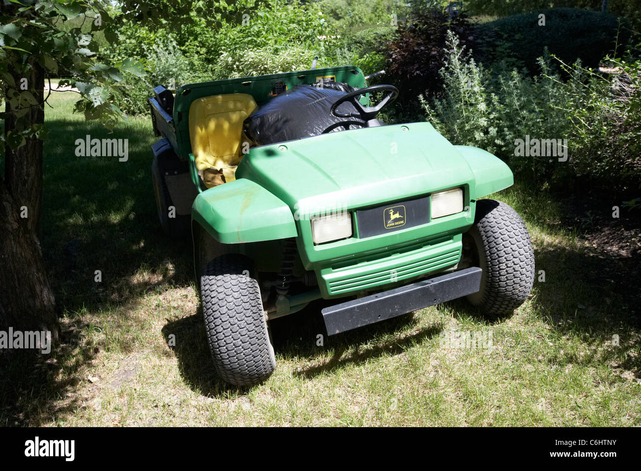 john deere gator golf carts used for gardening in local park winnipeg manitoba canada Stock Photo