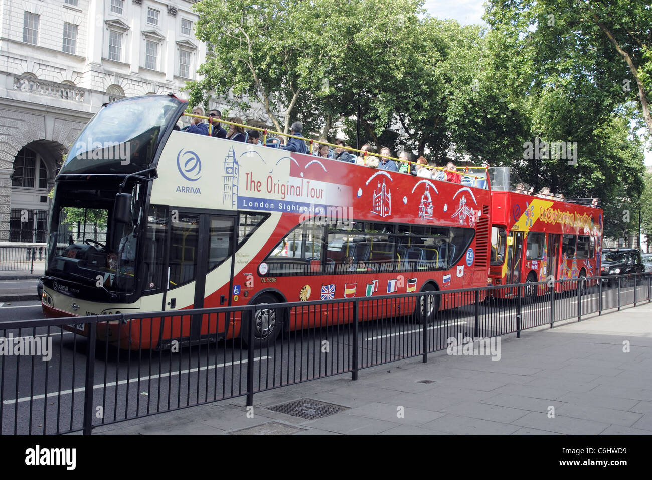 Red London sightseeing buses on the Victoria Embankment in London, England Stock Photo