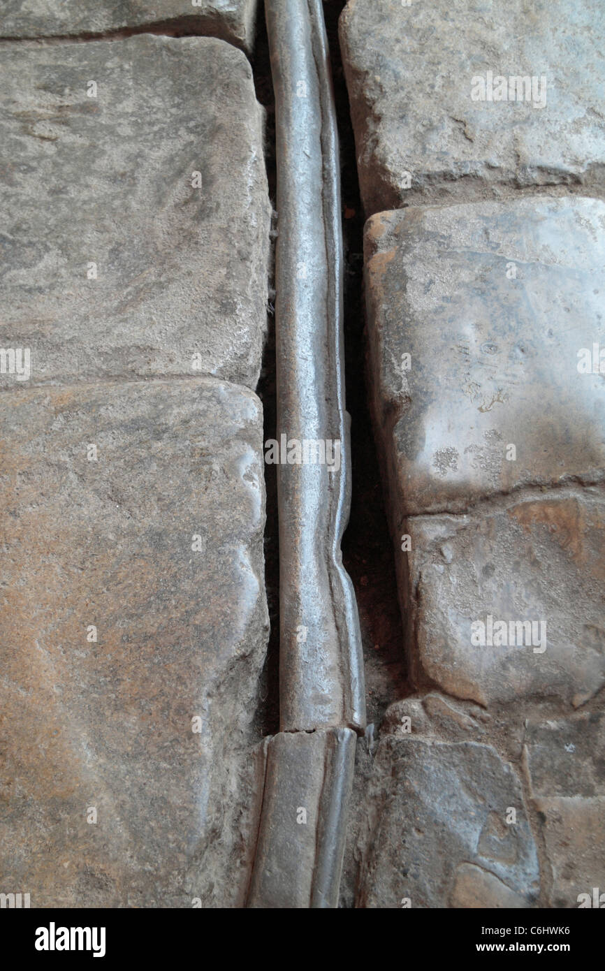 Original lead water pipe in the floor close to the Great Bath in The Roman Baths, Bath, Somerset