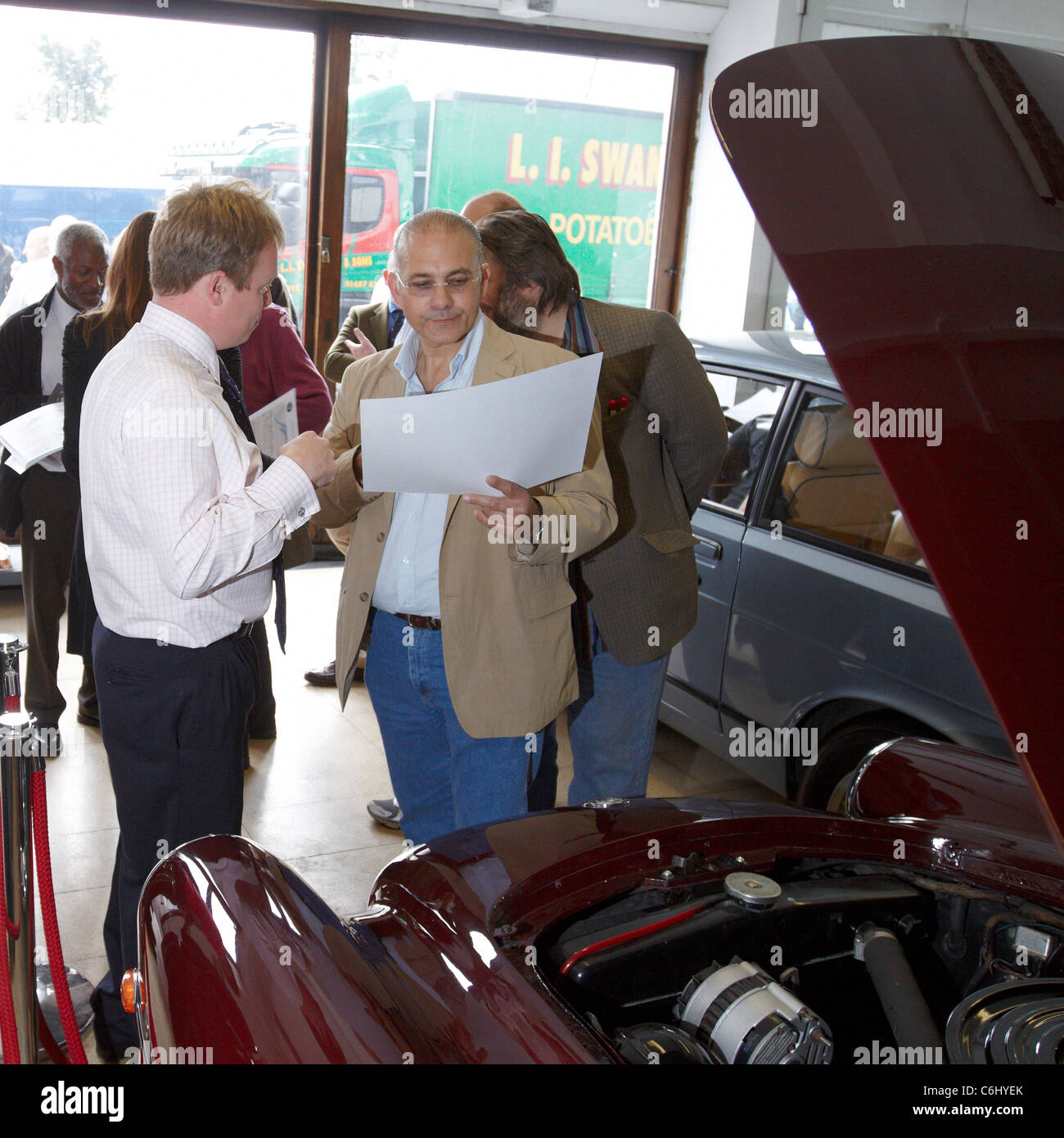 24 Bristol Cars leave from the company's Kensington showroom to drive