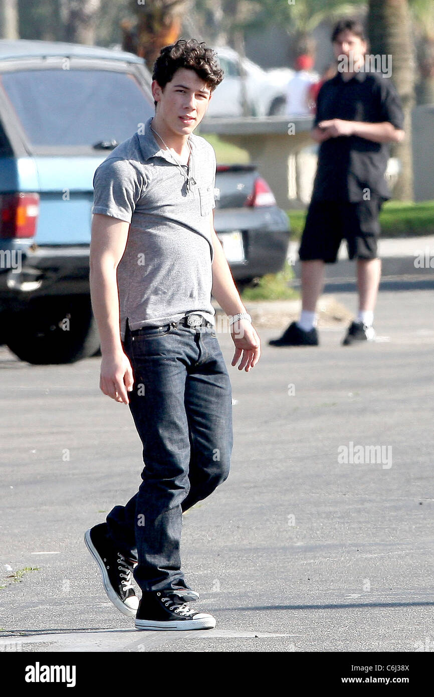 Nick Jonas Jonas Brothers playing American football between scenes on the  set of their new film, 'Chasing Butterflies' shooting Stock Photo - Alamy