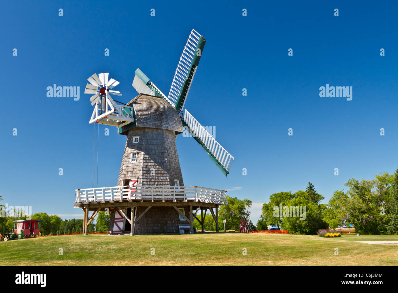 A windmill used for grinding grain into flour at the Mennonite Heritage Village in Steinbach, Manitoba, Canada. Stock Photo