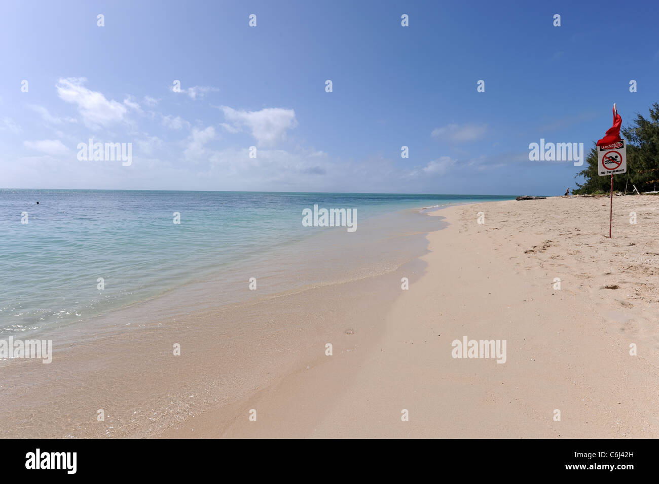beach scene with Danger, No swimming sign, Green Island, Great Barrier Reef, Queensland, Australia Stock Photo