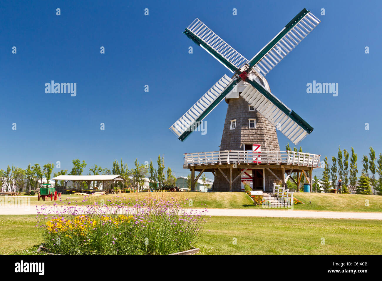 A windmill used for grinding grain into flour at the Mennonite Heritage Village in Steinbach, Manitoba, Canada. Stock Photo