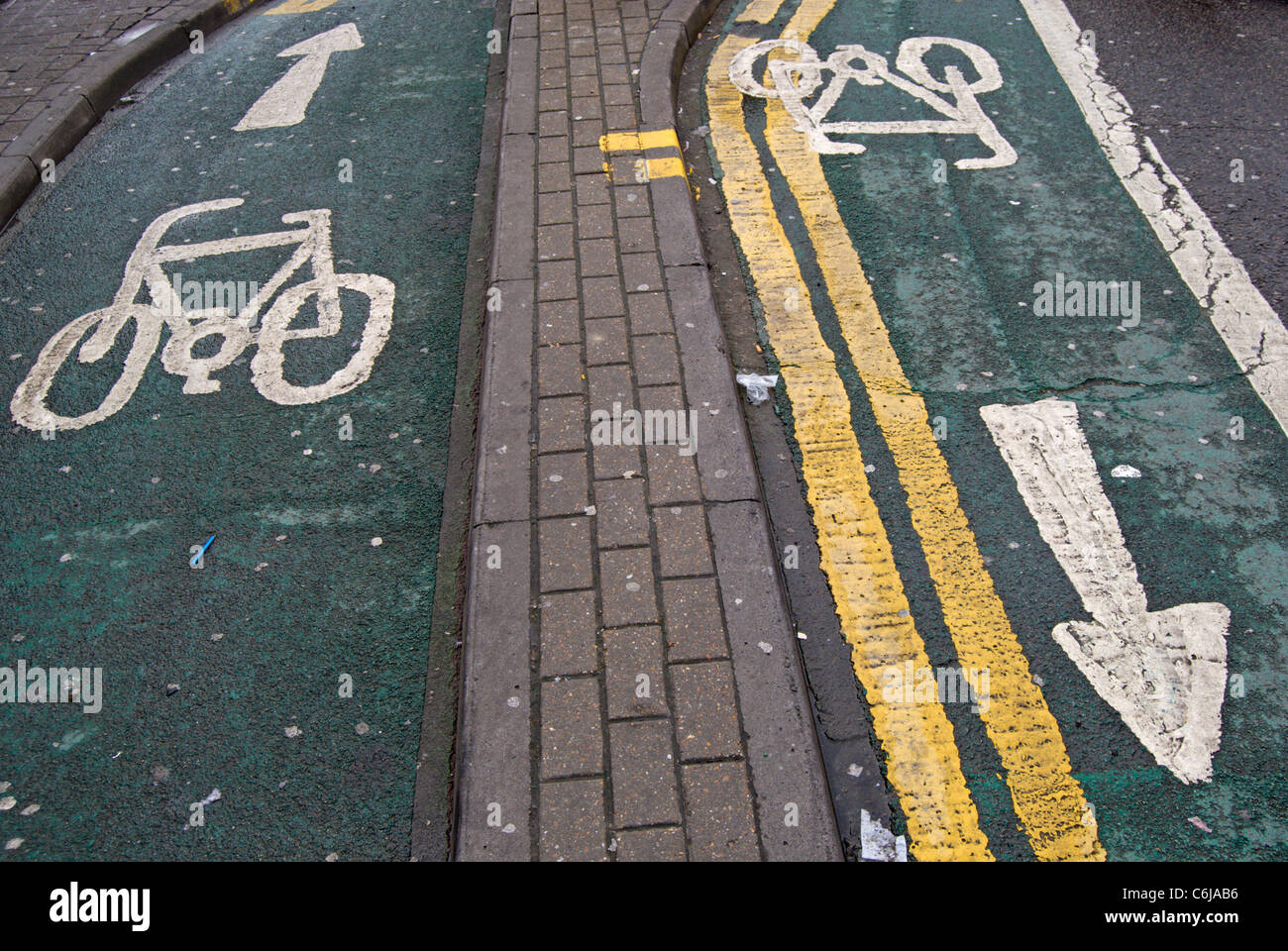 directional cycle paths in kingston upon thames, surrey, england, with arrows and bike images Stock Photo