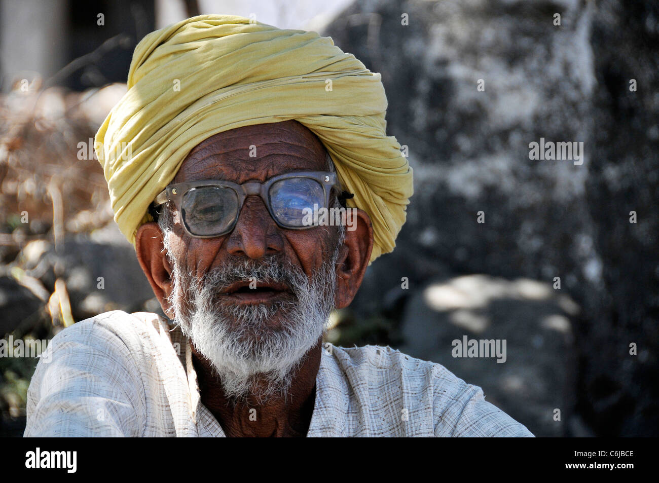 Portrait of old man wearing yellow turban Aravalli Hills Rajasthan ...