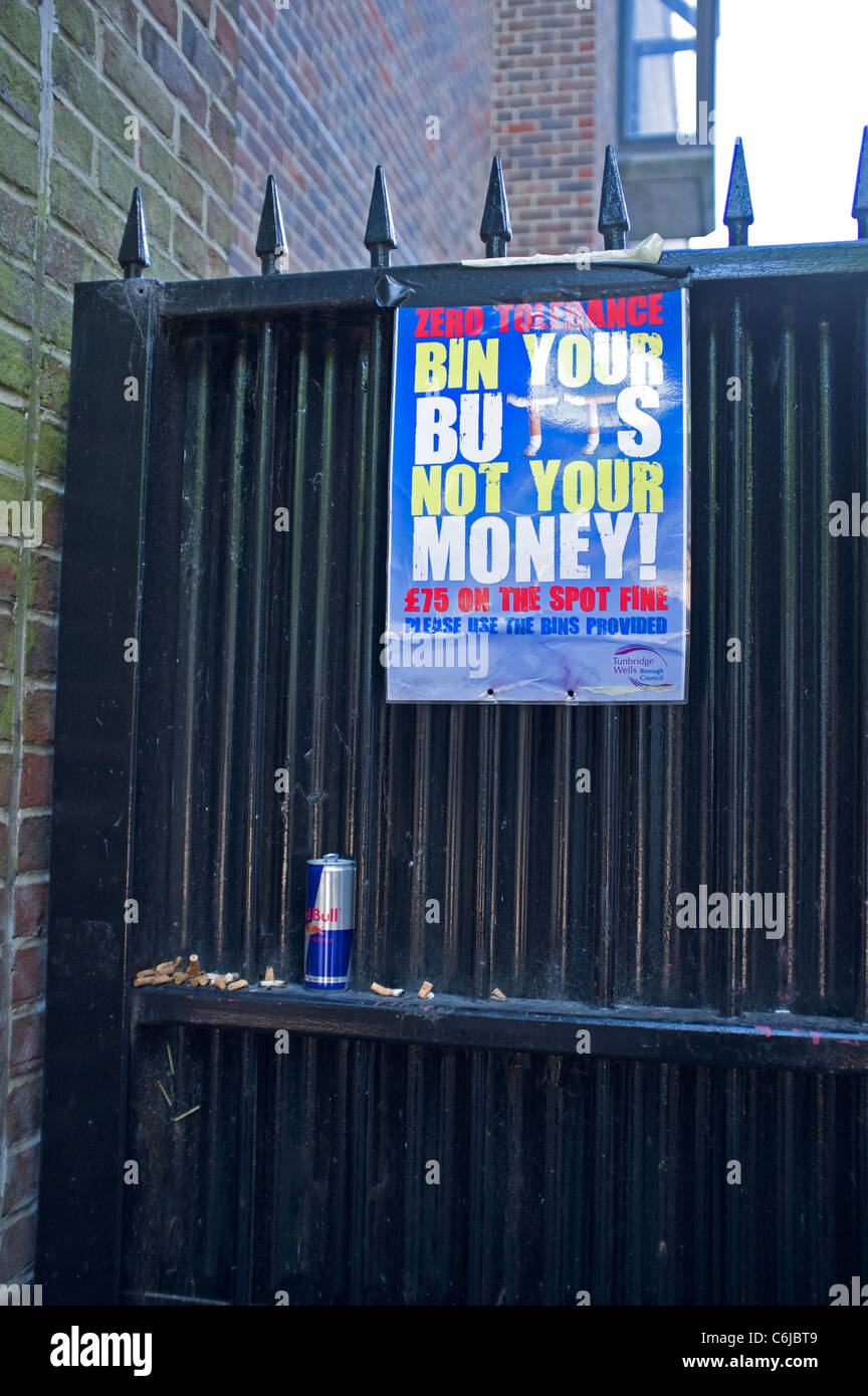 Zero tolerance bin your butts not your money! anti-litter poster Stock Photo