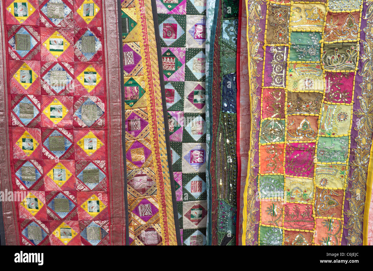 Patchwork quilts hanging in a market Stock Photo