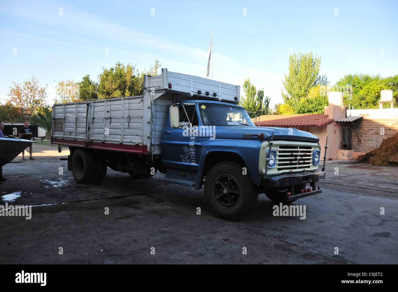 Grape-delivery lorry parked in a large yard, prior to tipping grapes for crushing, Carmine Granata Winery, Mendoza, Argentina Stock Photo