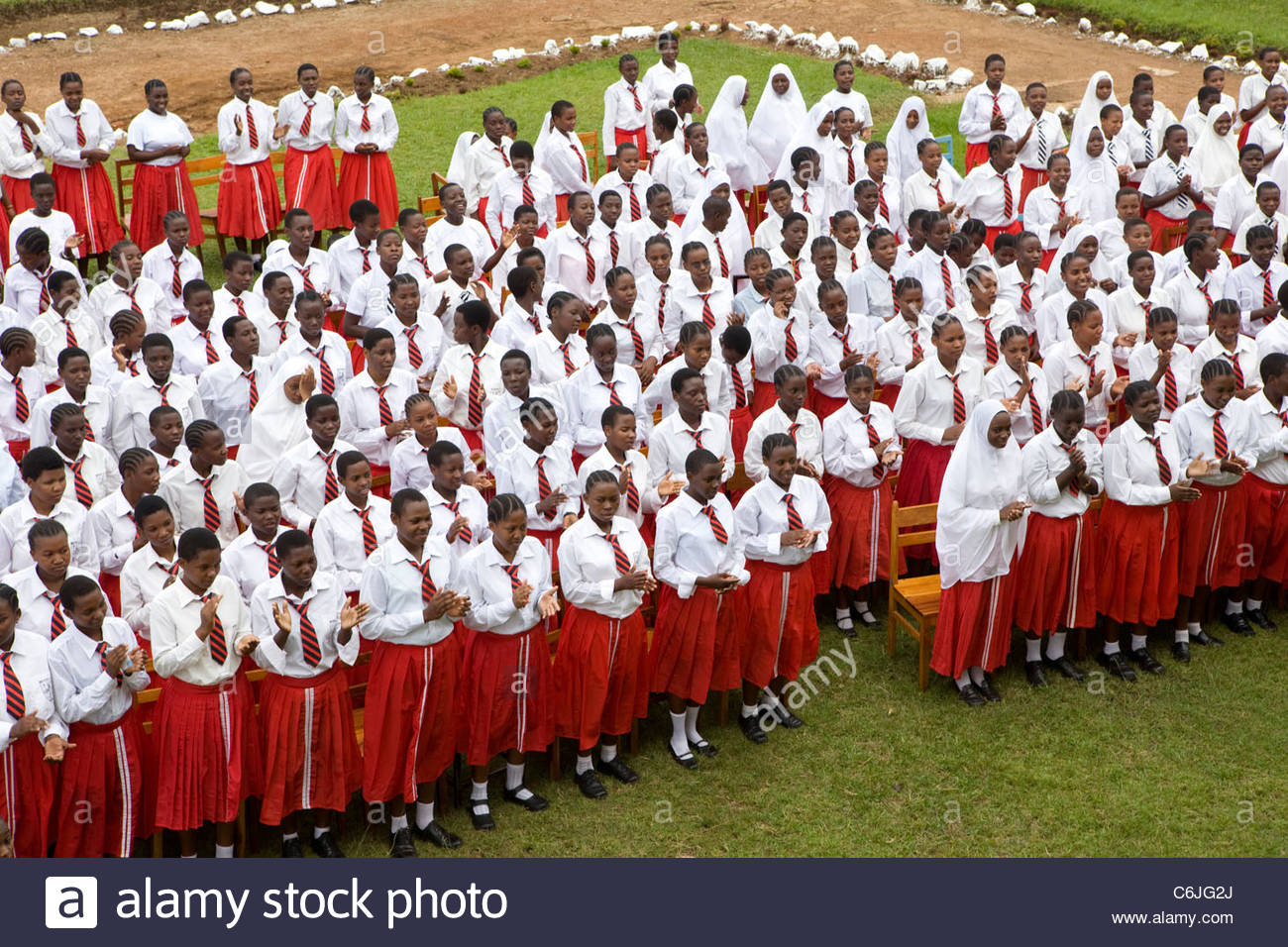 Secondary School Girls In Red And White Uniforms Assembled On The