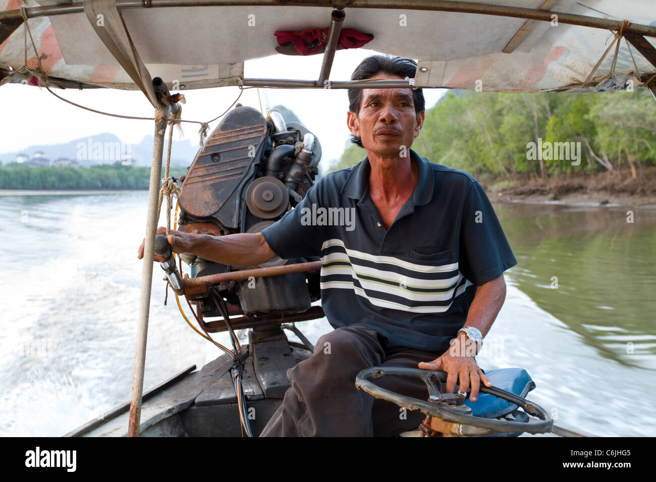 Long tail boat driving hi-res stock photography and images - Alamy