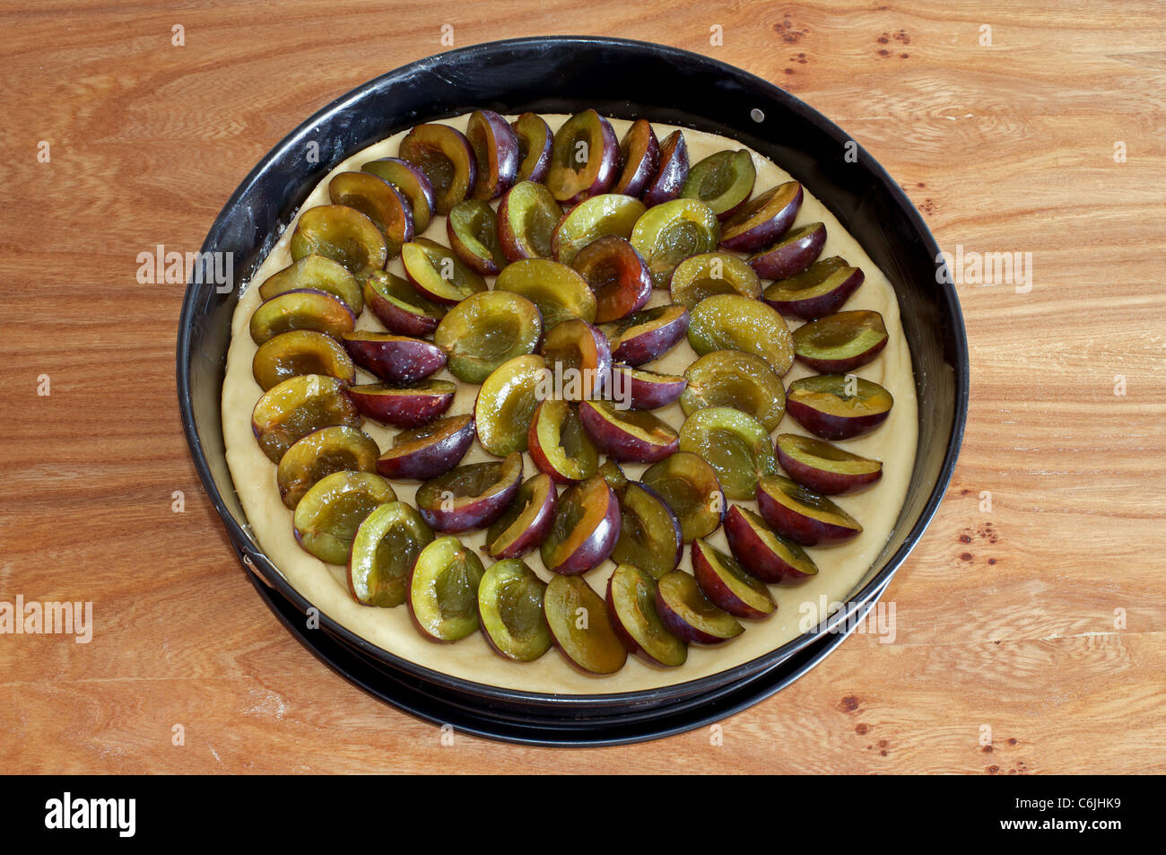 Homemade plum tart (uncooked) Stock Photo