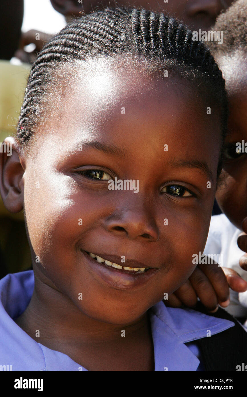 Portrait Of A Smiling Young Girl With A Braided Hairstyle Stock