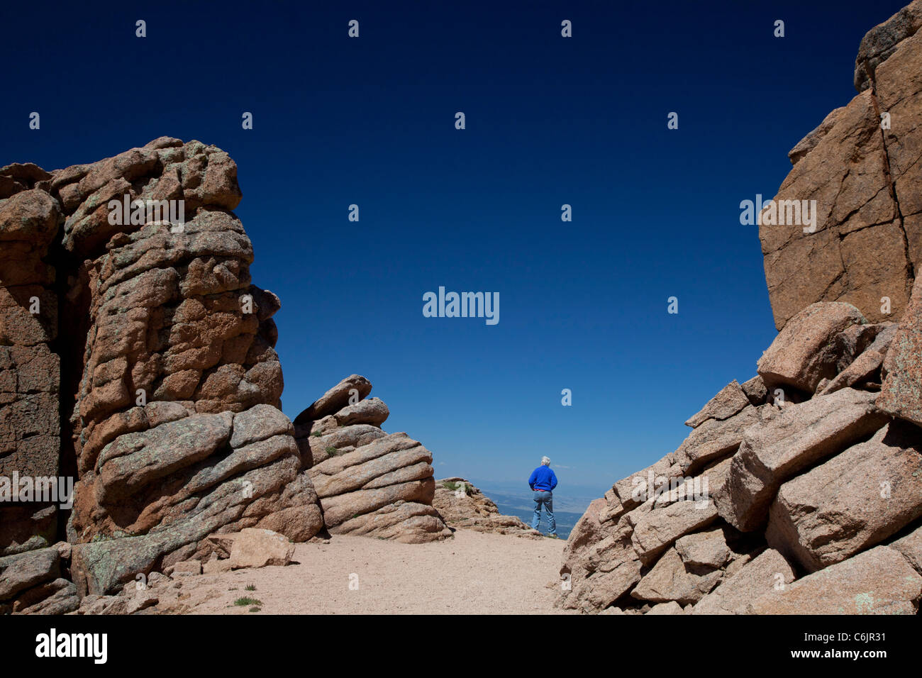 Colorado Springs, Colorado - Susan Newell, 62, hikes on a trail near the summit of Pikes Peak. MR Stock Photo