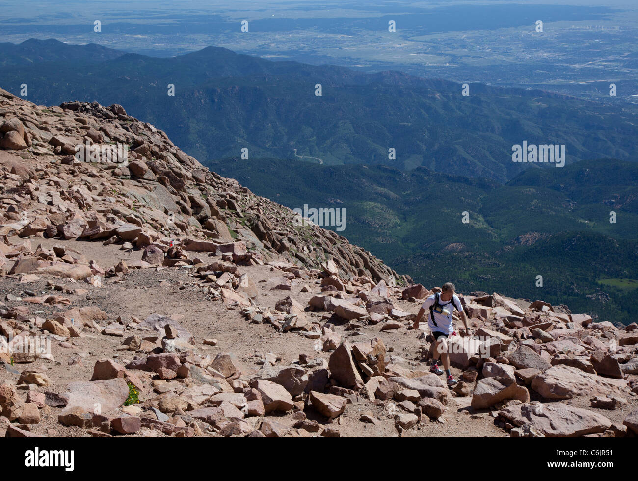 Colorado Springs, Colorado - A runner on the Barr Trail, a 12.6-mile trail that climbs to the 14,110-foot summit of Pikes Peak. Stock Photo