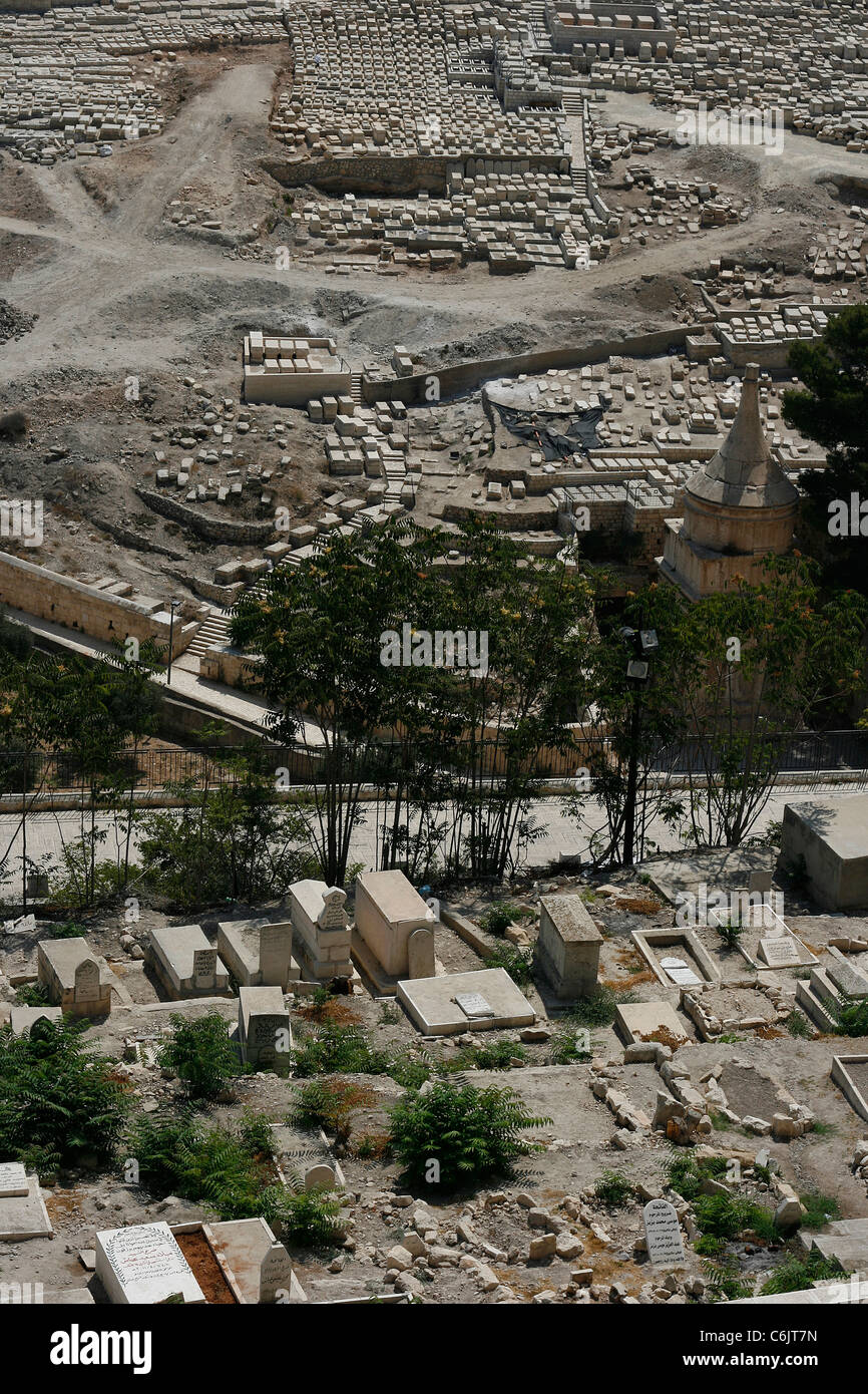 Islamic graves on the Temple Mount in front of the Jewish cemetery with the tomb of Absalon on the Mount of Olives in Jerusalem. Stock Photo