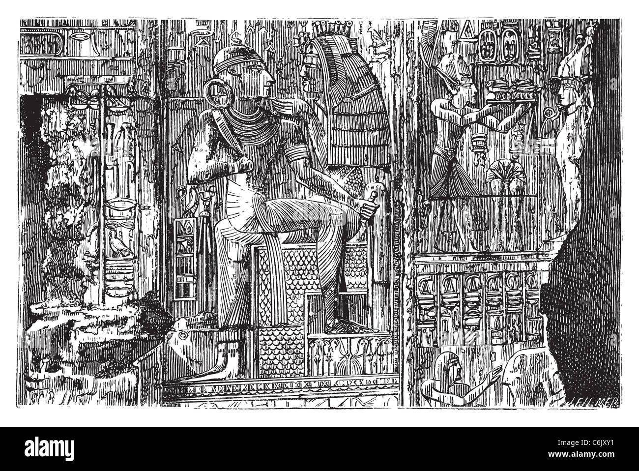 Abydos, Egypt. Bas-relief illustration of hieroglyph carvings on the wall. Complex scene carving of egyptian god. Stock Photo