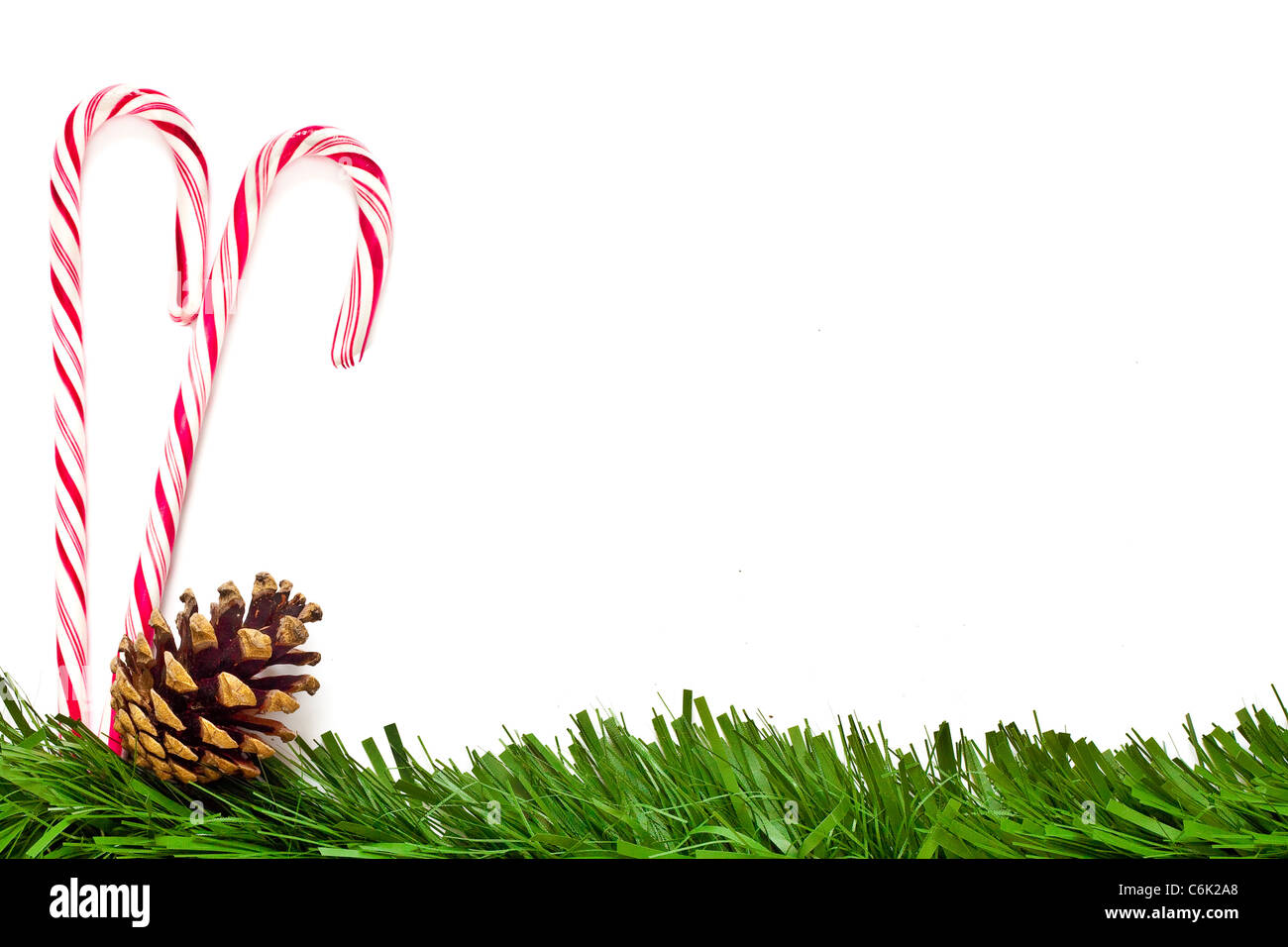 Christmas template with candy canes, pine cone and green border. This could  be used as a menu or greeting card Stock Photo - Alamy