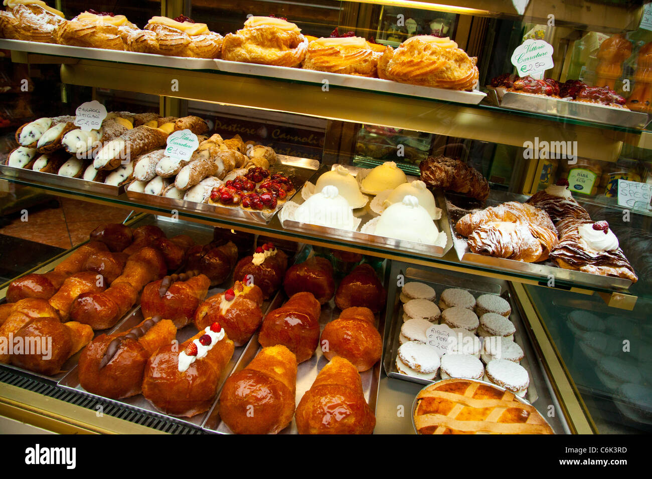 Local pastry treats in a shop in Piazza San Domenico Maggiore in Naples. Stock Photo