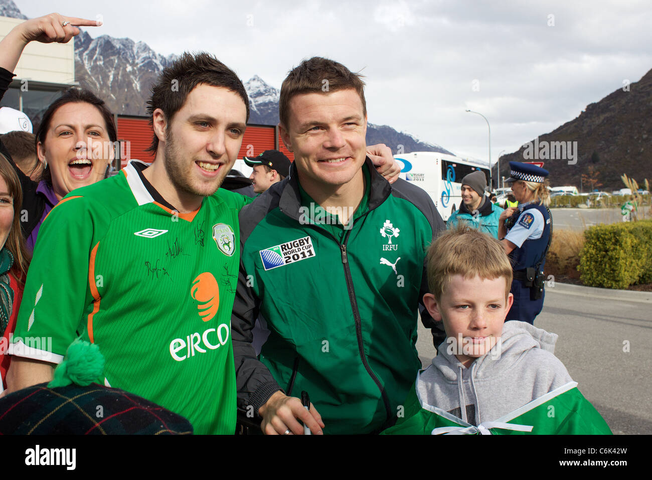 Brian O'Driscoll with Irish fans and Sam Teal, 9, (right) from Hawea Flats as the Irish Rugby Team arrive at Queenstown airport Stock Photo