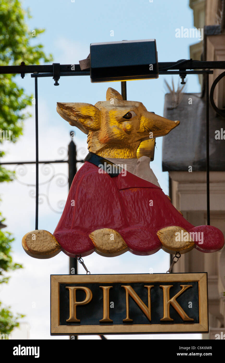 Sign outside Thomas Pink shirtmakers shop in Jermyn Street, London showing a fox wearing hunting pink. Stock Photo