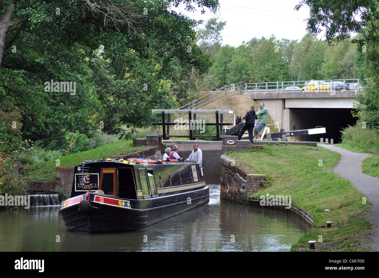 Narrowboat on the Stratford Canal with the M40 motorway behind, Warwickshire, UK Stock Photo