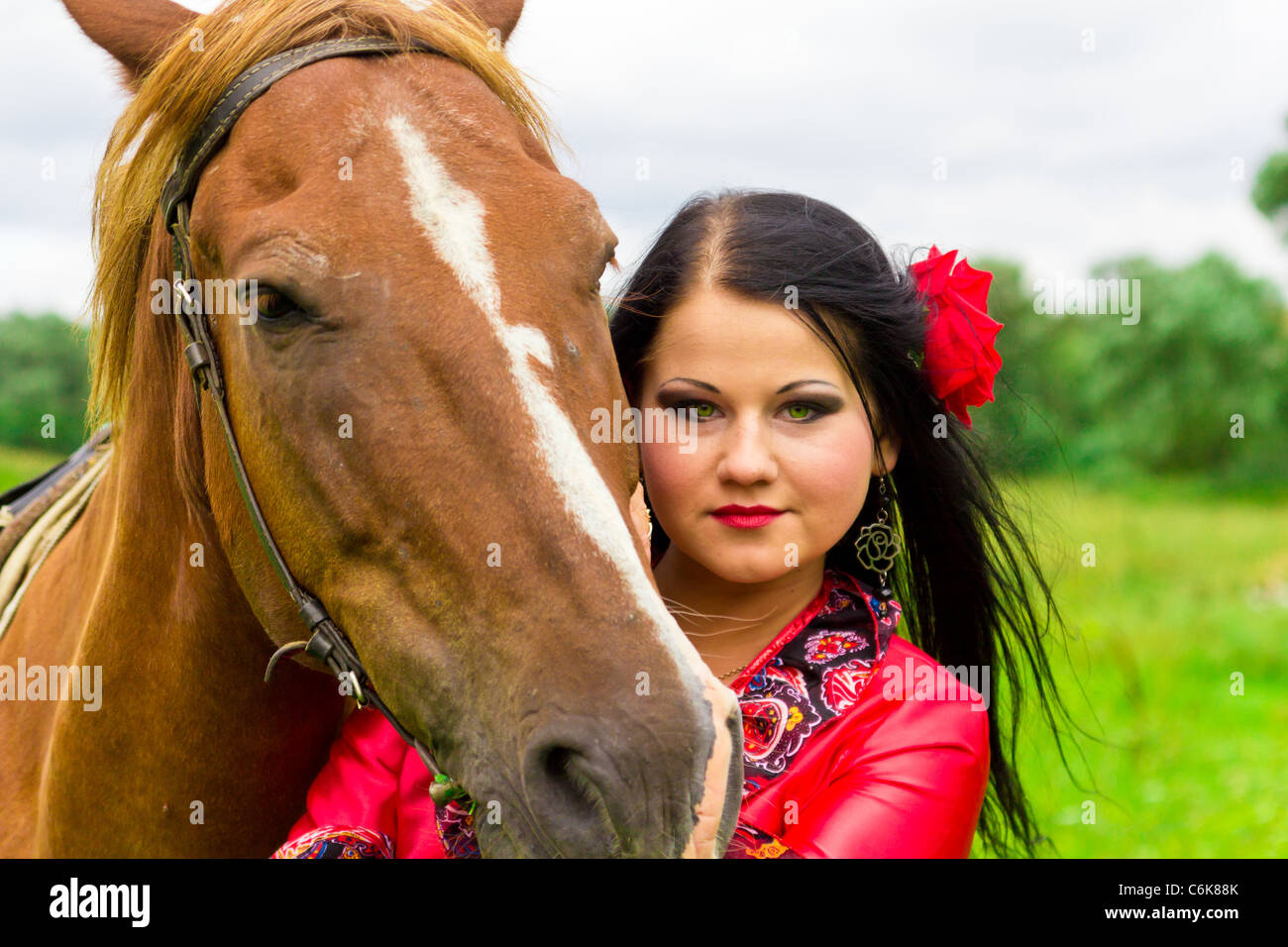 Beautiful gypsy girl riding a horse Stock Photo Alamy