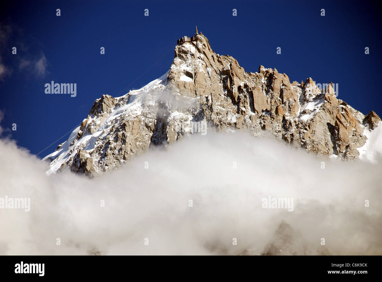 The mountains of the French alps are framed by  a layer of low cloud Stock Photo