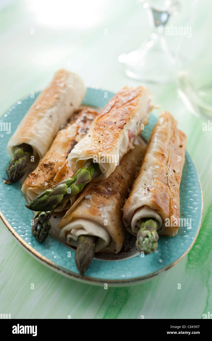 Asparagus wraps Stock Photo