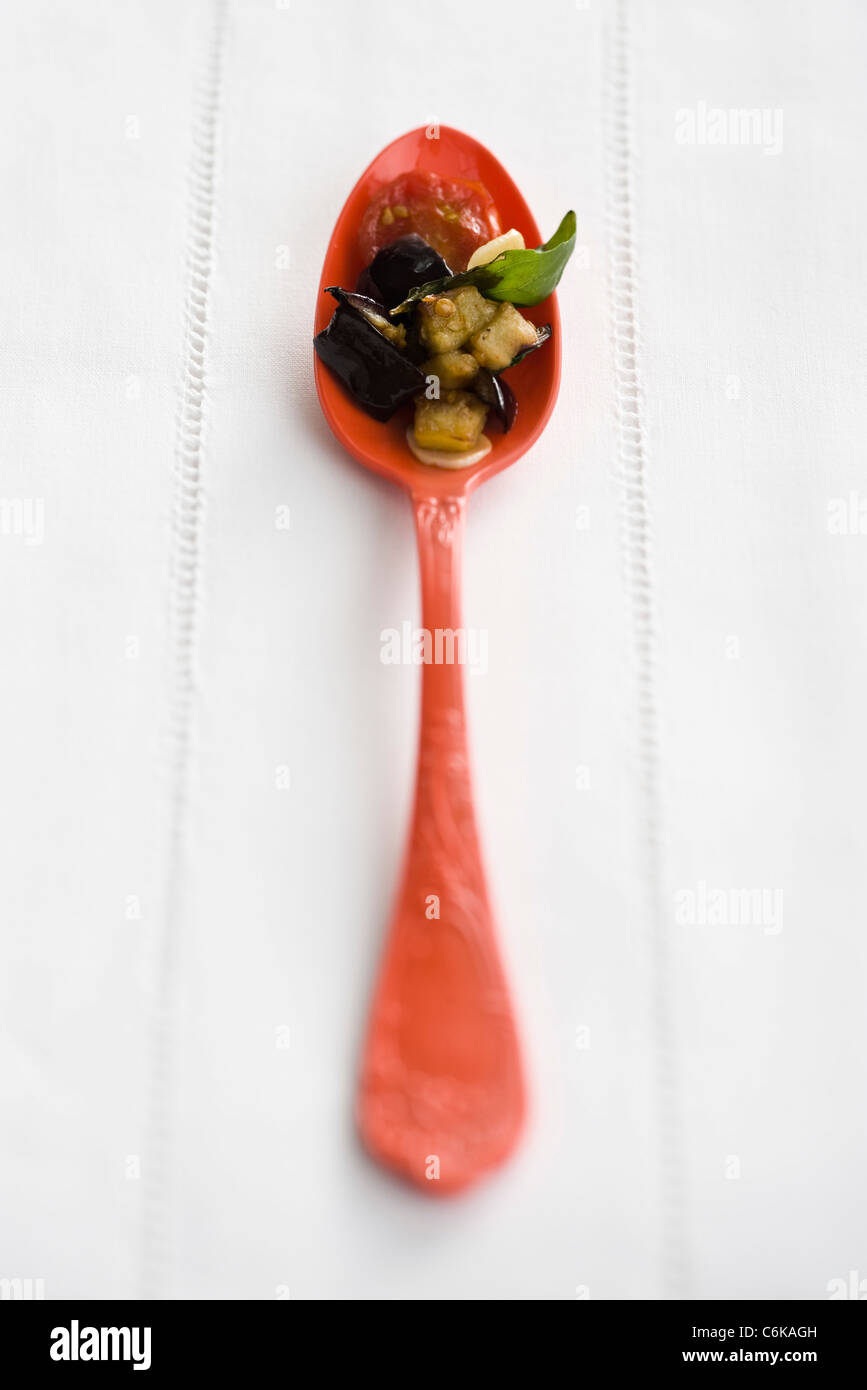 Pan-fried eggplant with tomatoes and basil Stock Photo