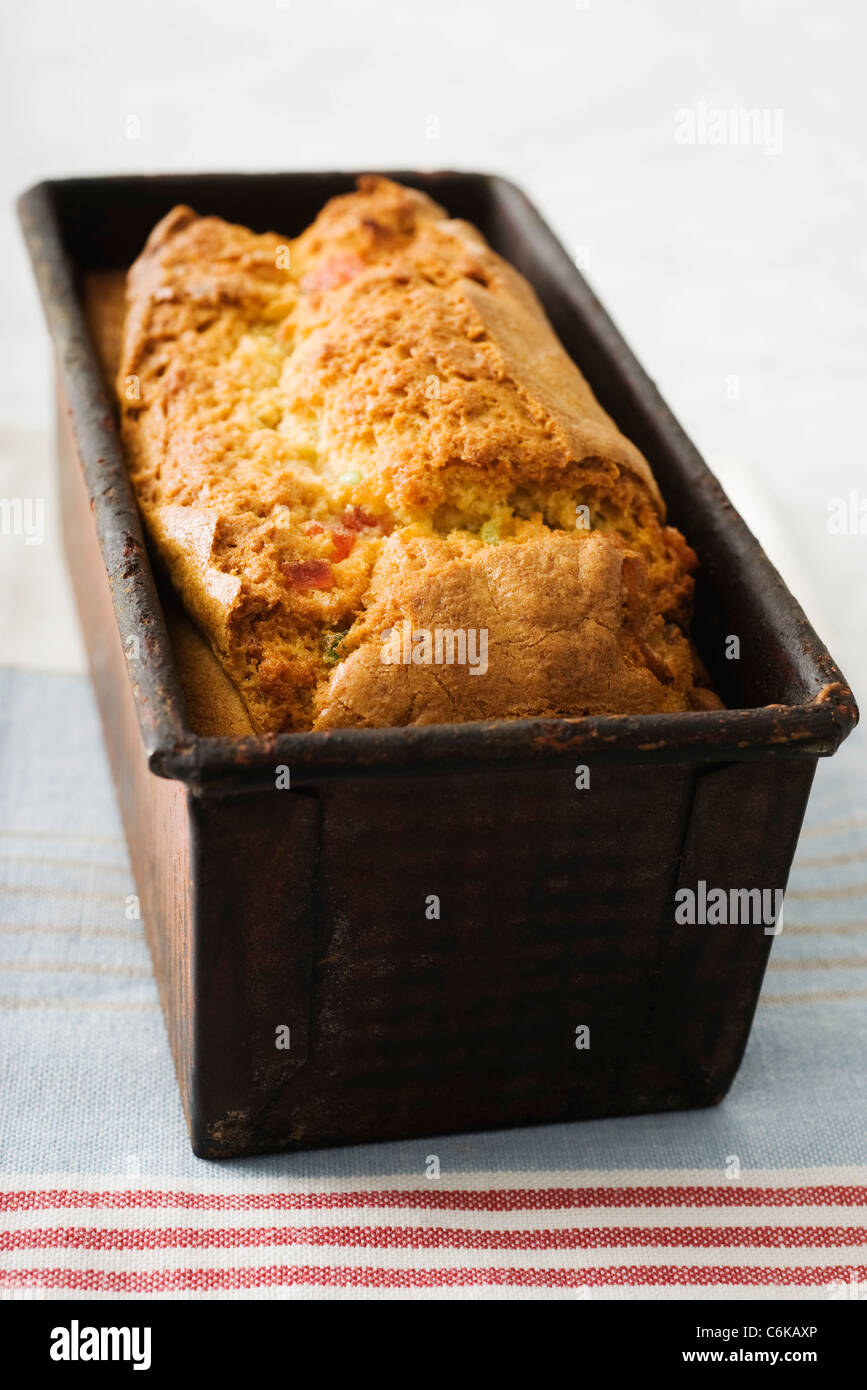 Freshly baked Ginger fruitcake in loaf pan Stock Photo