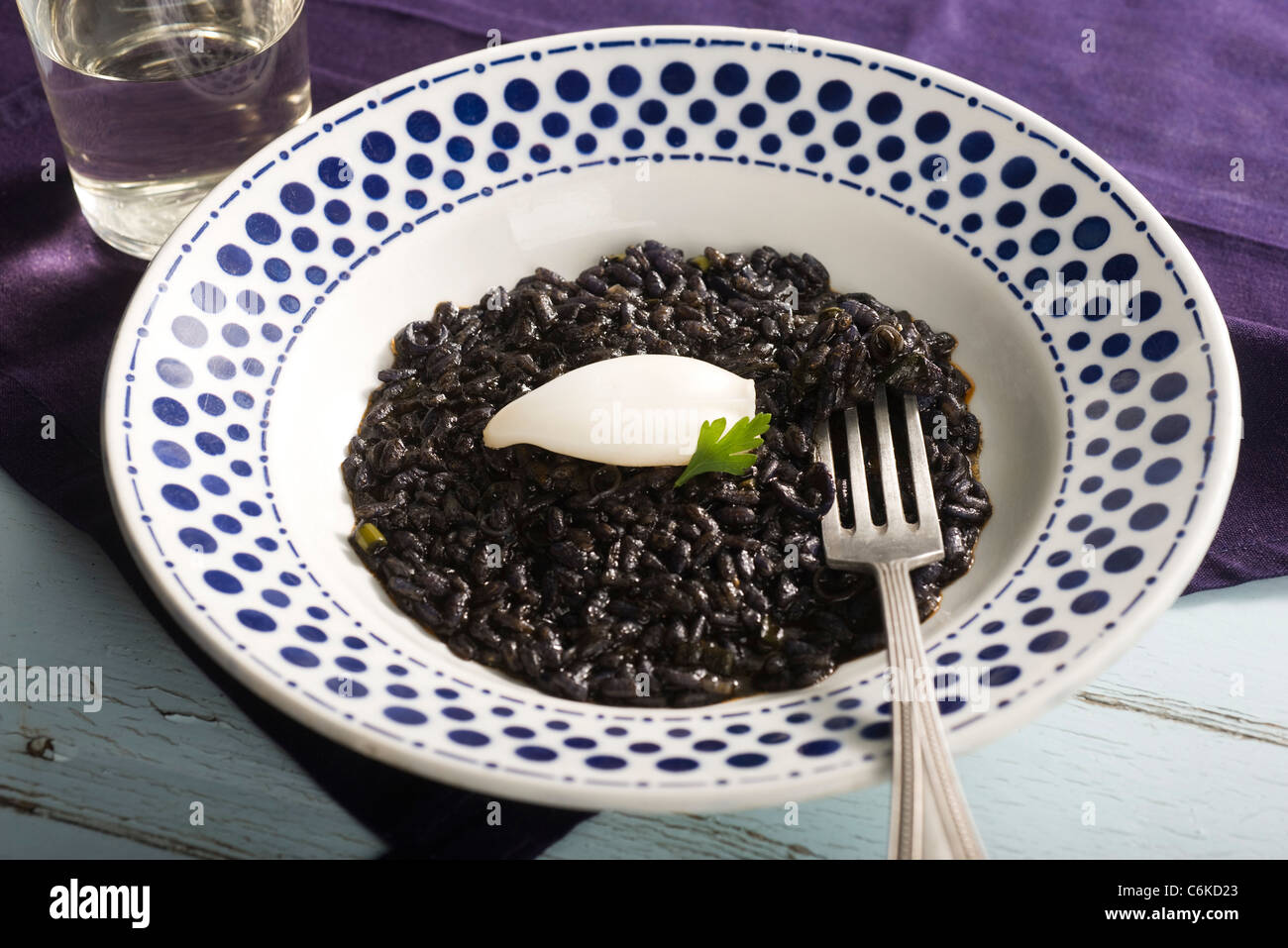 Squid ink risotto Stock Photo