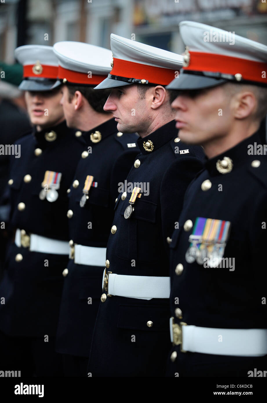 Royal Marines in dress uniform amongst mourners gathered for a ...