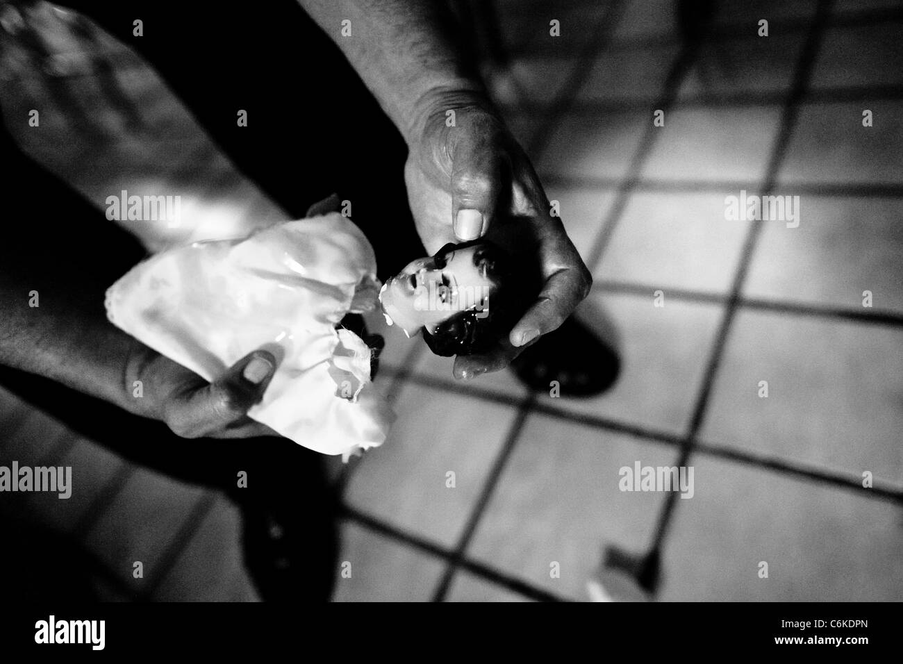 Pastor Hugo Alvarez breaks an idol during the exorcism ritual at the Church of the Divine Saviour in Mexico City, Mexico. Stock Photo